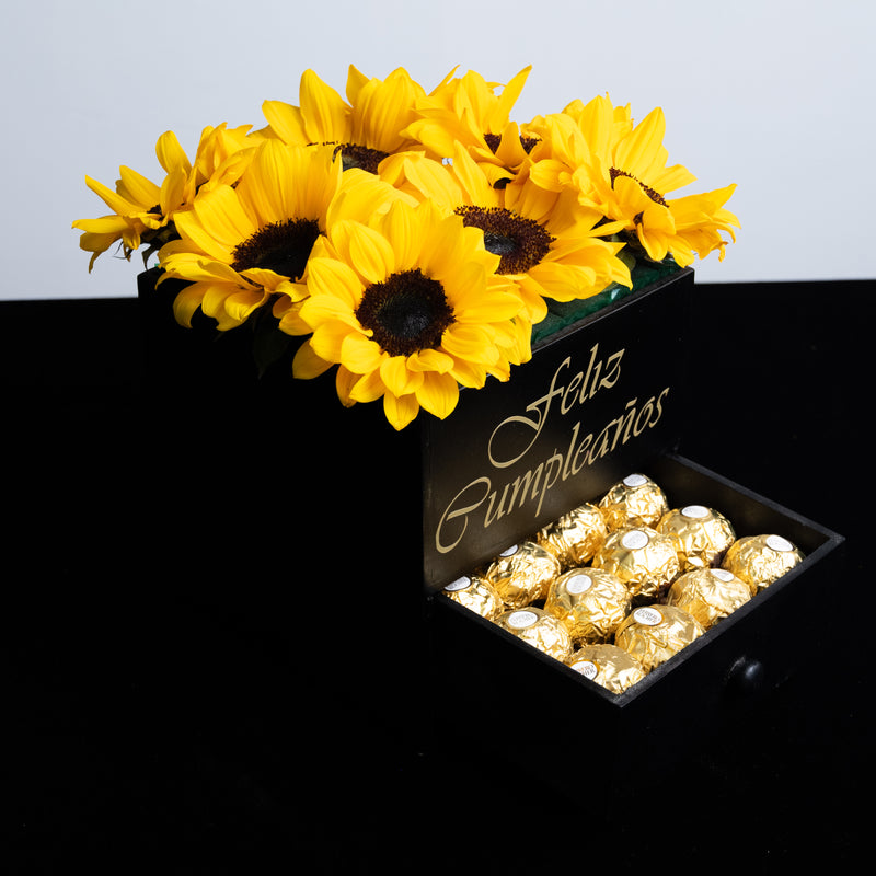 Caja de girasoles y chocolates